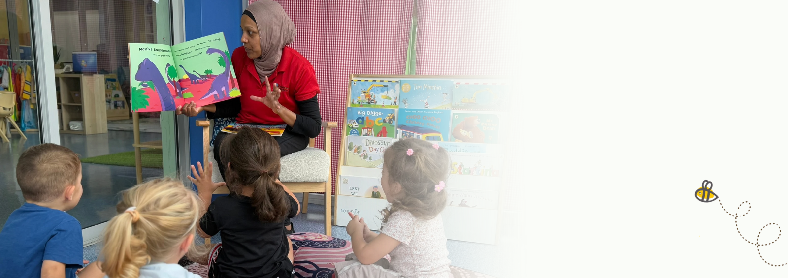 Teacher engaging children with a story during a classroom reading session.